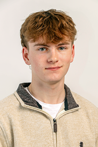 Headshot of team member Eli Delano